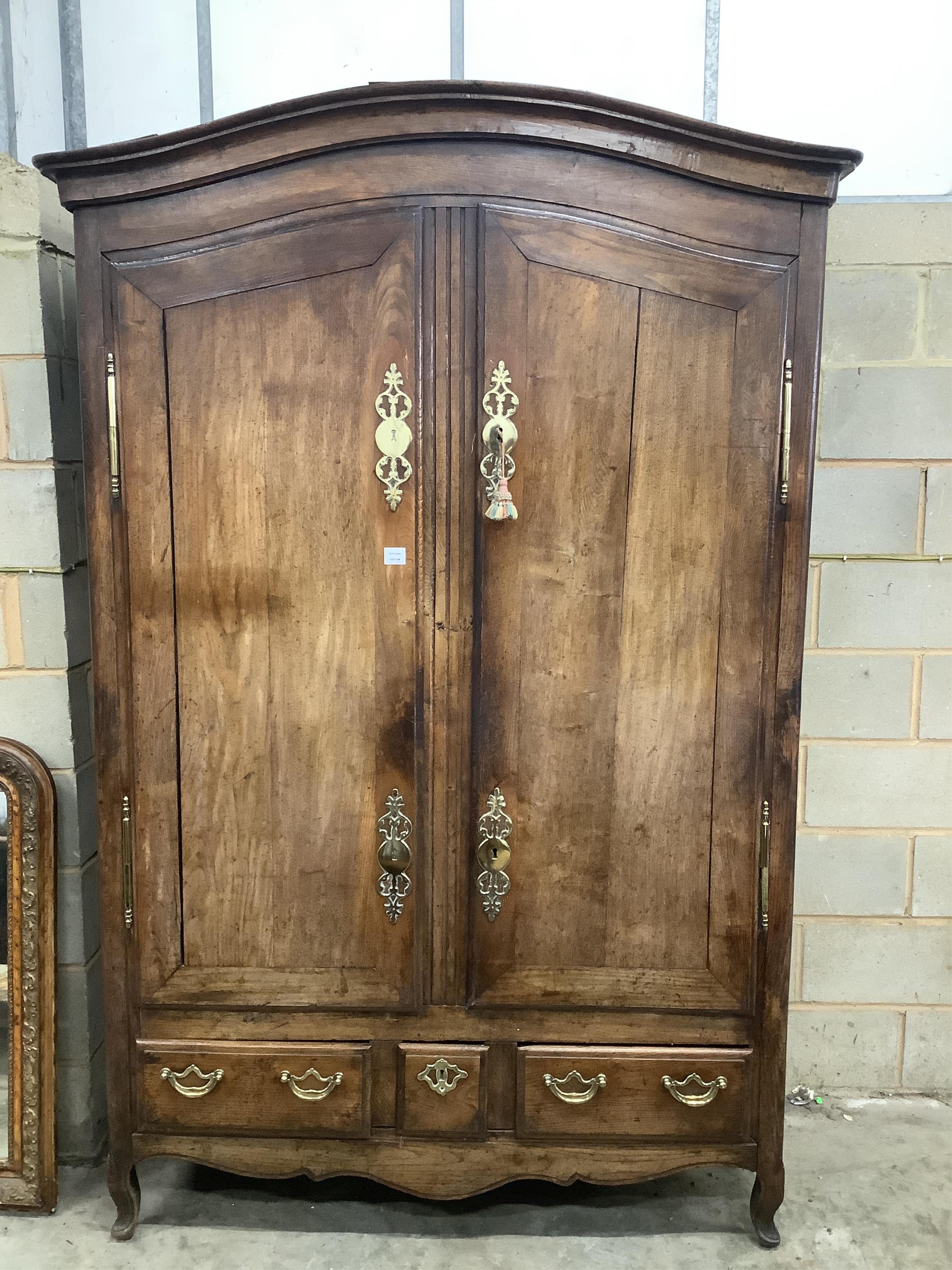 A late 18th century French provincial walnut armoire, width 150cm, depth 64cm, height 231cm. Condition - fair